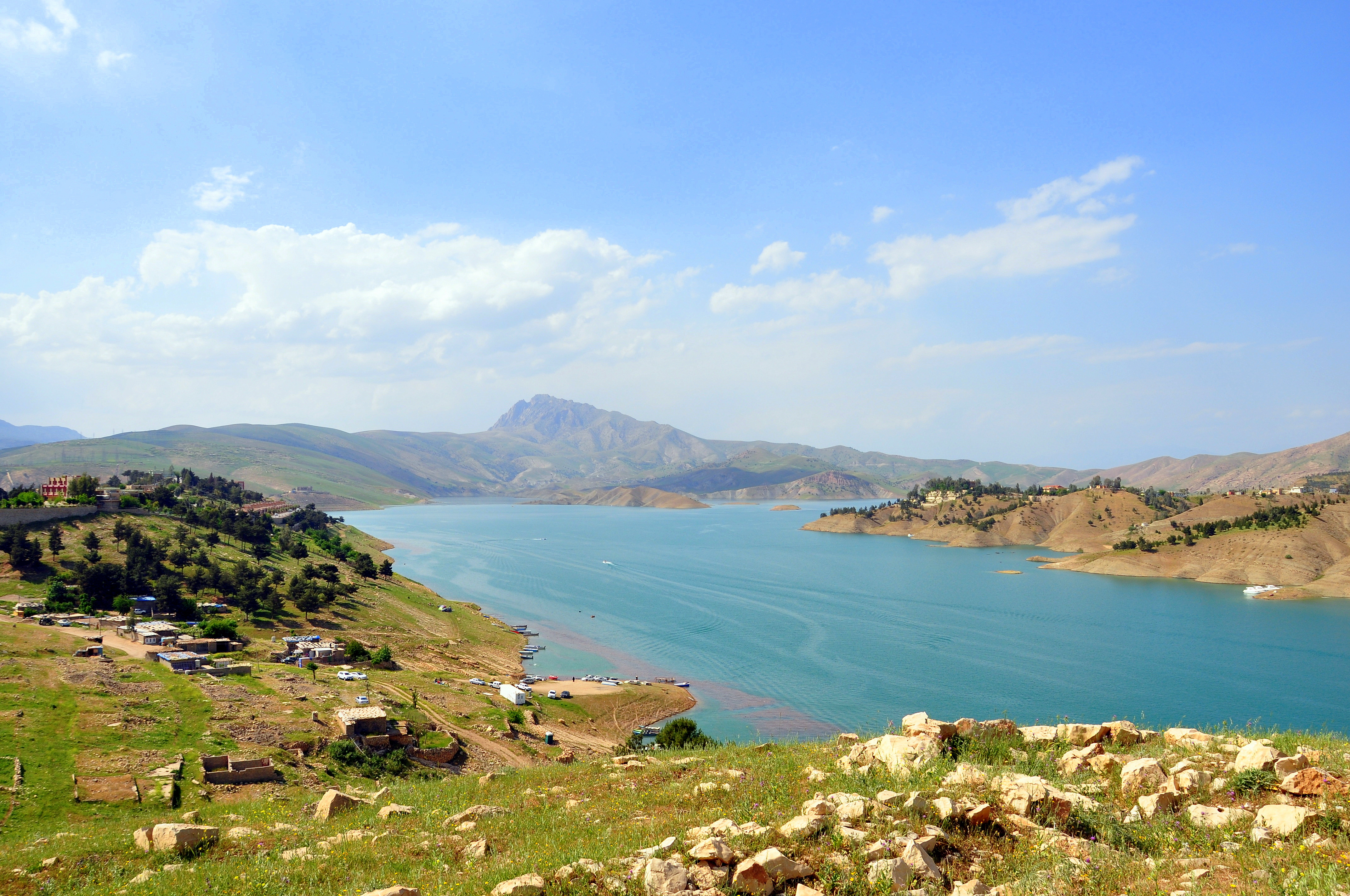 The wide blue waters of Dukan Lake among mountains in the Kurdistan Region of Iraq