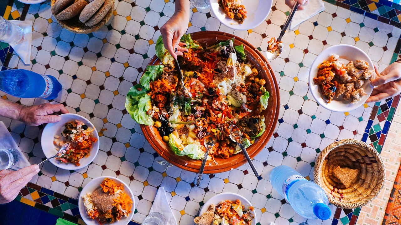 Traditional Kurdish food spread — families share large picnic meals during Newroz.