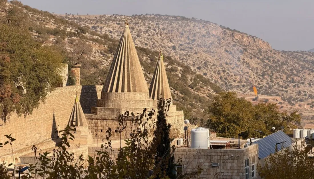 Conical spires of the Lalish temple in a green valley, Kurdistan Region of Iraq