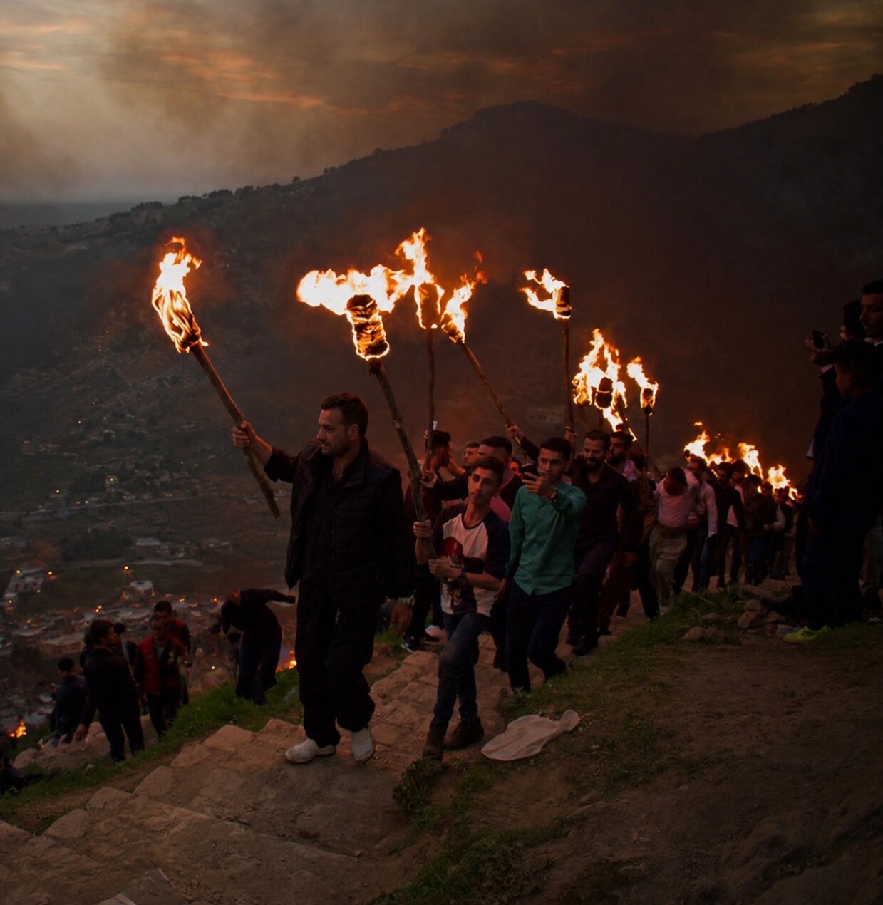 Newroz celebration in the Kurdistan Region with bonfires and traditional Kurdish dress.