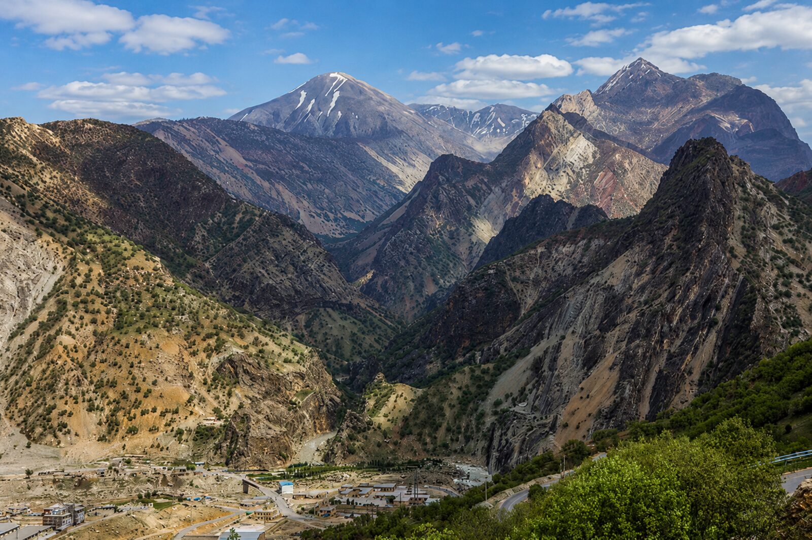 Snow-streaked peaks and deep green valleys of the Zagros mountains in the Kurdistan Region of Iraq